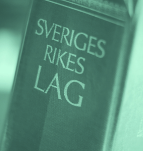 Lagbokens rygg där texten Sveriges rikes lag står skrivet.
